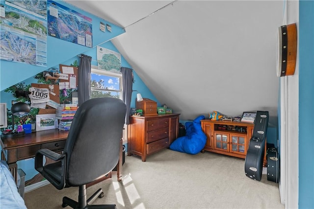 office space featuring light carpet and vaulted ceiling