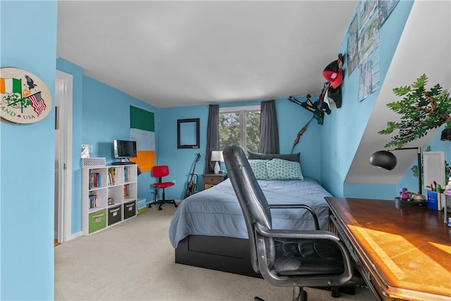 bedroom with carpet floors and baseboards