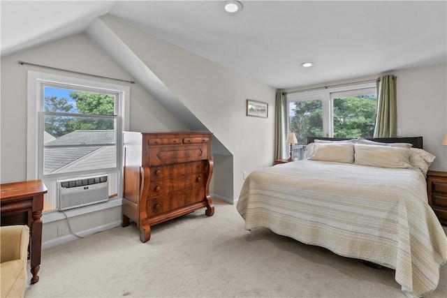 bedroom featuring light carpet, multiple windows, vaulted ceiling, and cooling unit