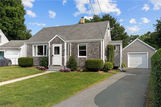 view of front of property with a front lawn, a chimney, a detached garage, and a shingled roof