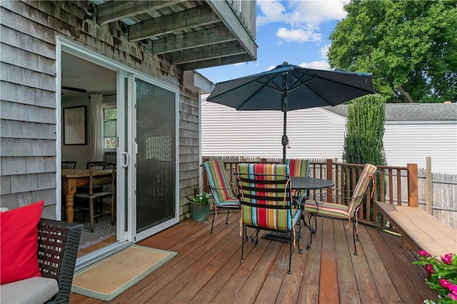 wooden deck featuring outdoor dining space