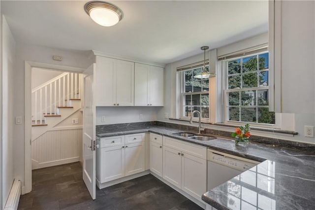 kitchen featuring pendant lighting, a baseboard heating unit, white cabinetry, a sink, and white dishwasher