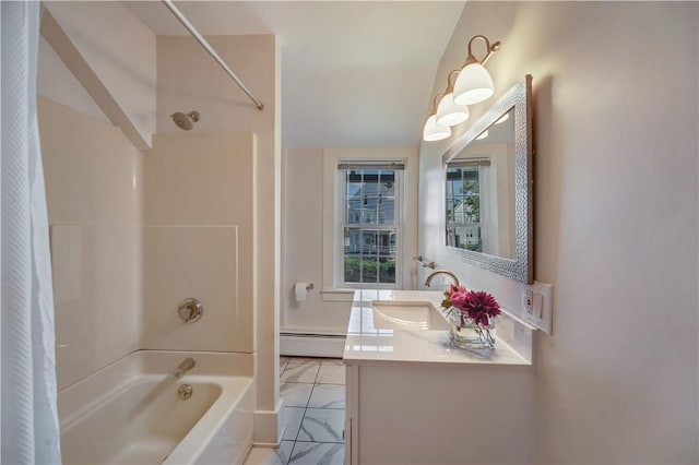 bathroom featuring marble finish floor, vanity, baseboard heating, and shower / bath combo with shower curtain