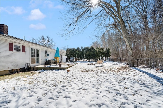 view of yard layered in snow