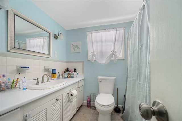 full bathroom with vanity, toilet, and tile patterned floors