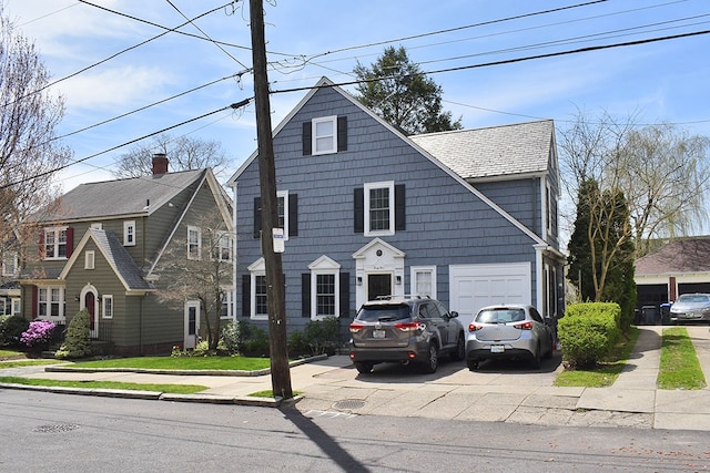 view of front of property with driveway and an attached garage