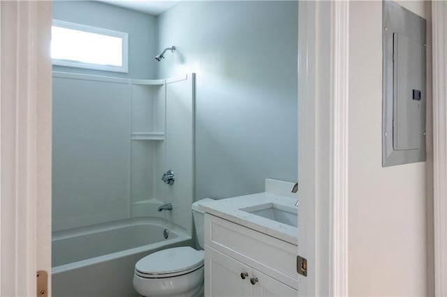 bathroom with toilet, electric panel, washtub / shower combination, and vanity