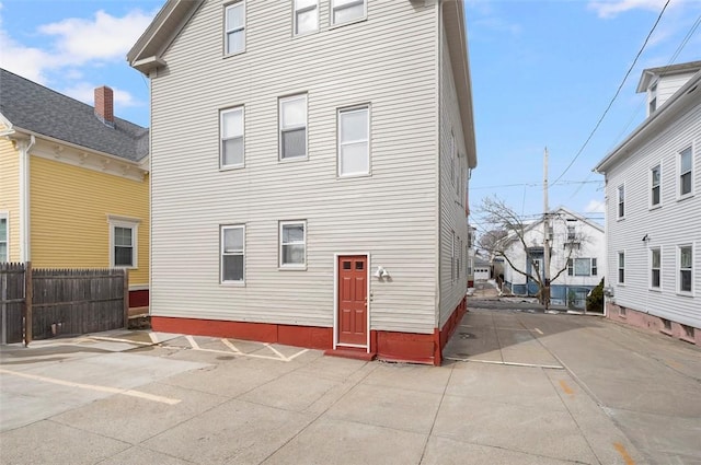 rear view of house with fence