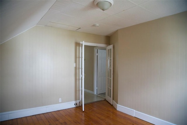 interior space featuring baseboards and wood finished floors