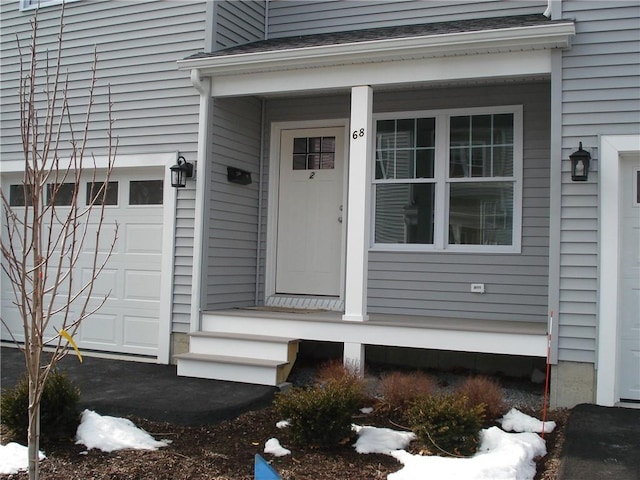 property entrance with a garage