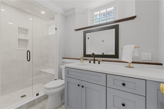 full bathroom with ornamental molding, a stall shower, vanity, and toilet