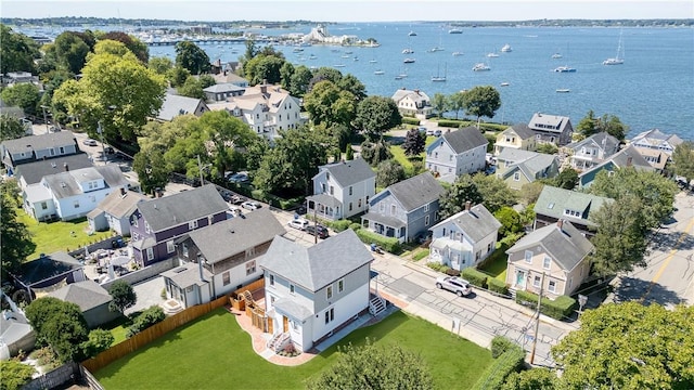 drone / aerial view with a water view and a residential view