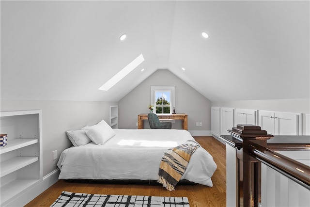 bedroom featuring dark wood-type flooring, lofted ceiling with skylight, recessed lighting, and baseboards