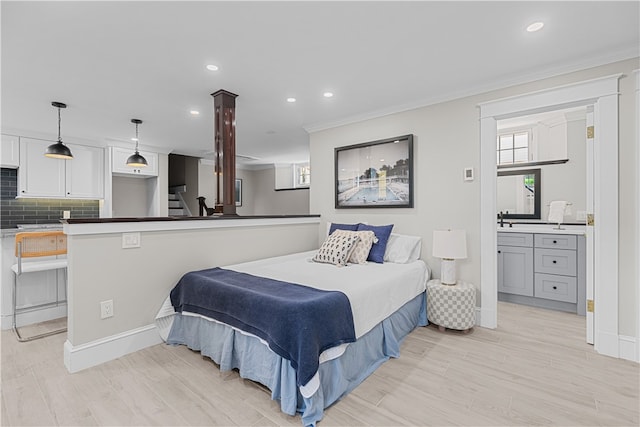 bedroom featuring baseboards, light wood finished floors, recessed lighting, and crown molding