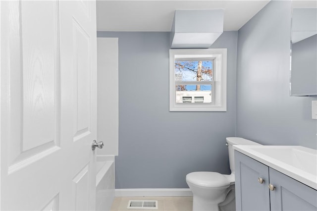 bathroom featuring baseboards, visible vents, toilet, tile patterned floors, and vanity