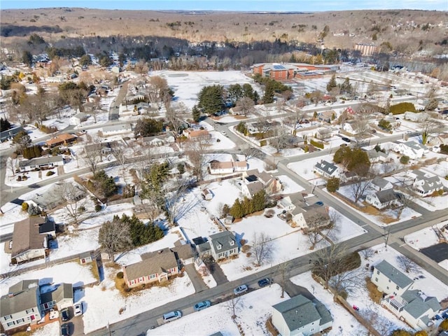 snowy aerial view featuring a residential view