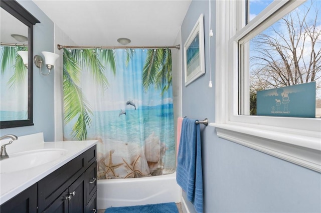 full bathroom featuring shower / bathtub combination with curtain and vanity