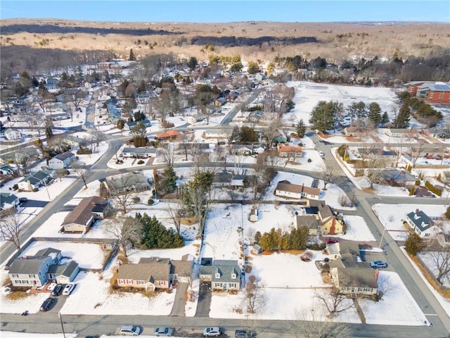 snowy aerial view featuring a residential view