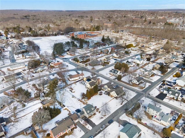 snowy aerial view with a residential view