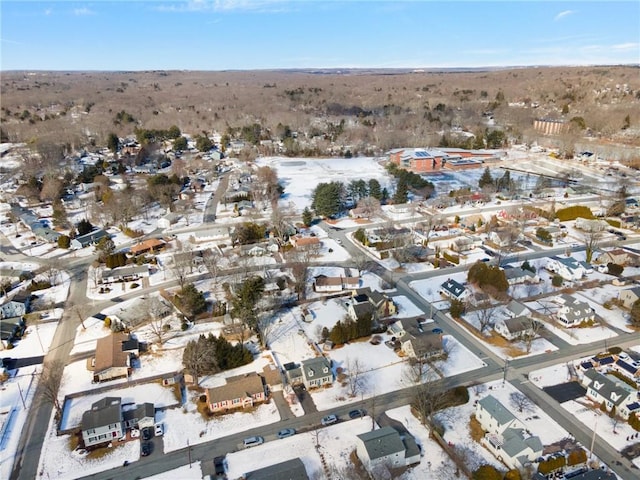 snowy aerial view with a residential view