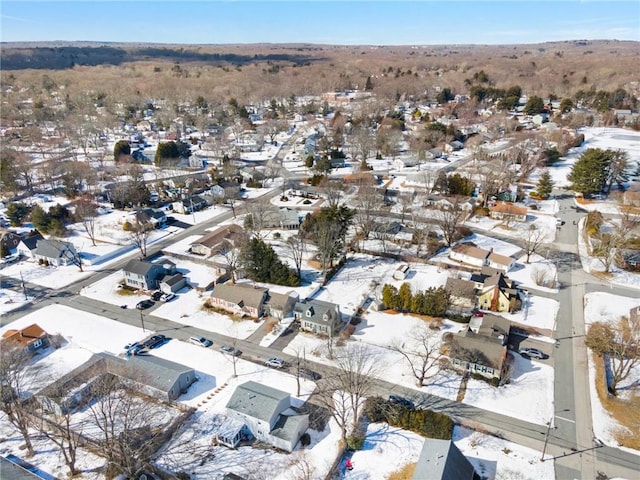 snowy aerial view featuring a residential view