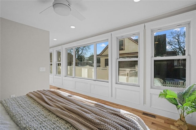 unfurnished bedroom with ceiling fan, wood finished floors, visible vents, and recessed lighting