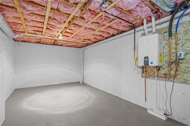 unfinished basement featuring water heater