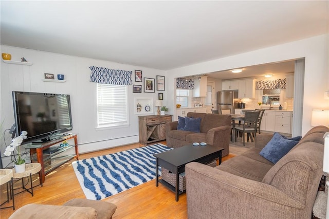 living area featuring light wood-style flooring