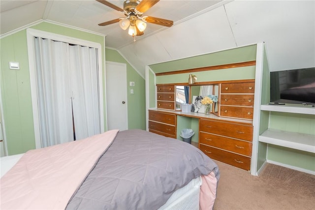 bedroom featuring carpet flooring, vaulted ceiling, and ceiling fan