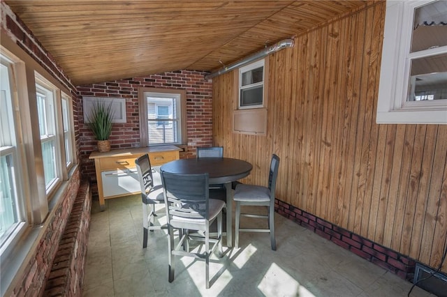 sunroom with lofted ceiling and wooden ceiling