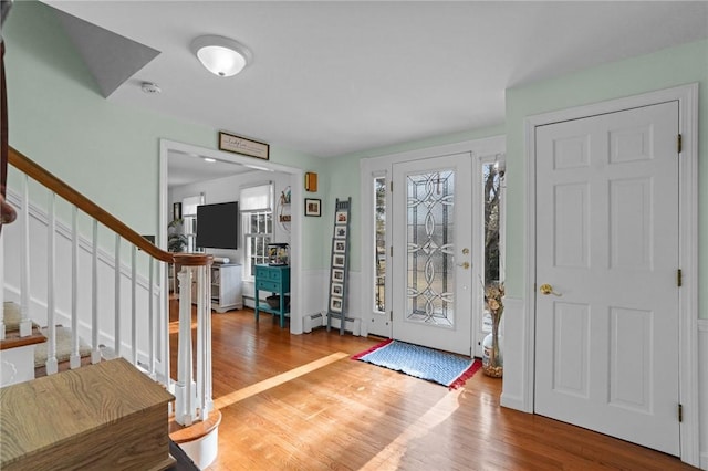 foyer with stairs and light wood-type flooring