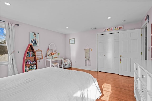 bedroom featuring recessed lighting, visible vents, and light wood finished floors