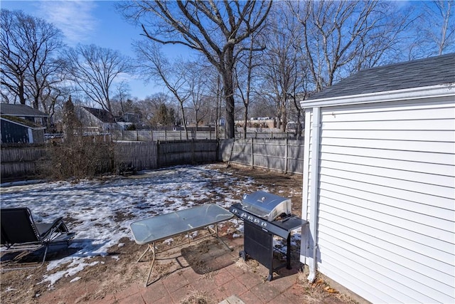 view of patio featuring a fenced backyard and a grill