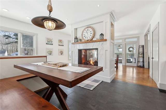 dining space featuring a fireplace, visible vents, and recessed lighting