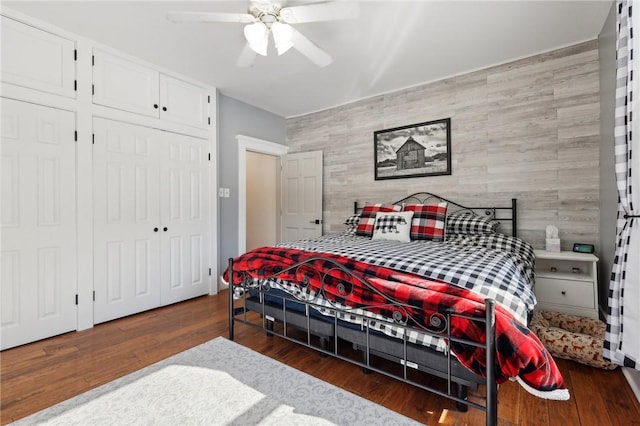 bedroom featuring a closet, a ceiling fan, and wood finished floors