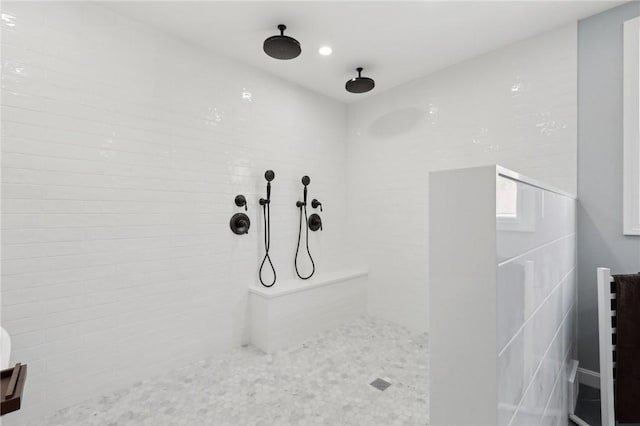 bathroom with a tile shower