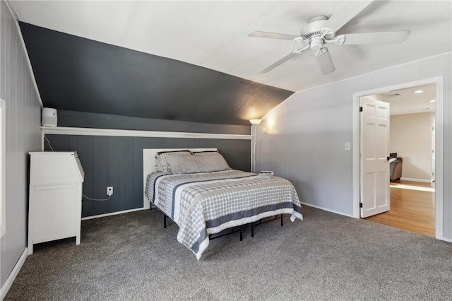 bedroom with vaulted ceiling, carpet floors, and a ceiling fan