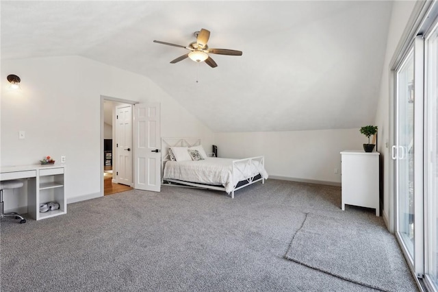 unfurnished bedroom with vaulted ceiling, ceiling fan, carpet flooring, and baseboards