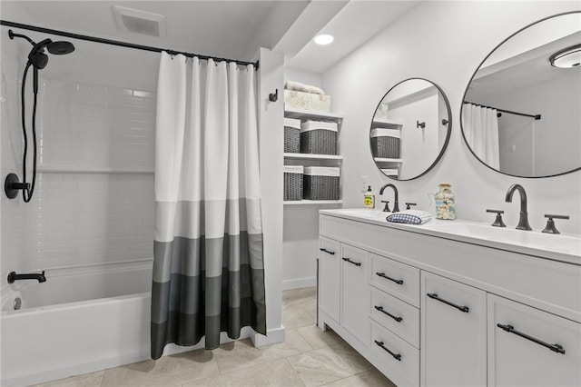 bathroom featuring double vanity, a sink, visible vents, and shower / tub combo with curtain