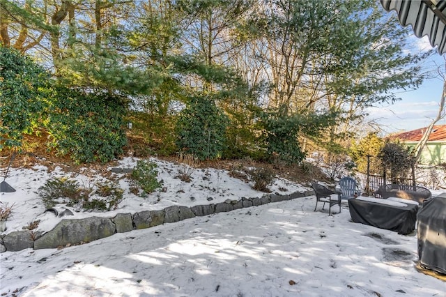 view of yard layered in snow