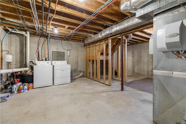 unfinished basement featuring separate washer and dryer