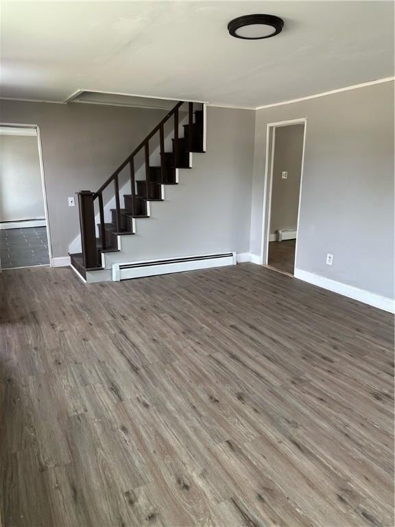 unfurnished living room featuring dark wood-style floors, a baseboard radiator, stairway, and baseboards