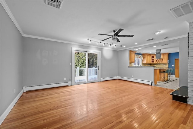 unfurnished living room with visible vents, crown molding, and baseboard heating