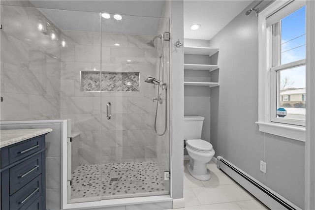 full bathroom featuring a baseboard radiator, tile patterned flooring, toilet, vanity, and a shower stall