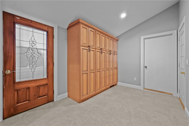 interior space featuring recessed lighting, vaulted ceiling, and baseboards