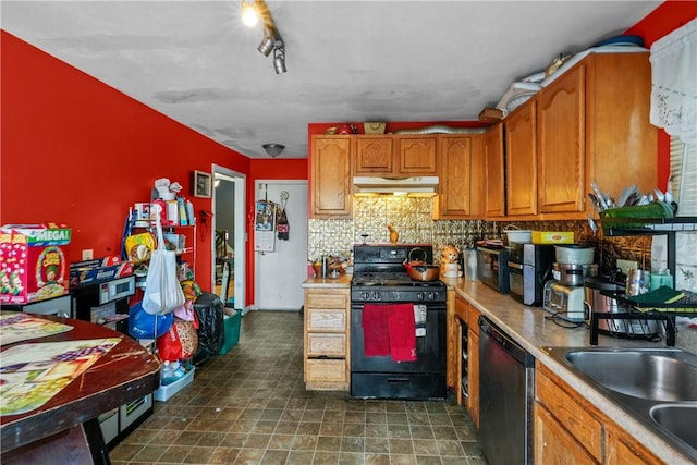 kitchen with dishwasher, black gas range oven, brown cabinets, light countertops, and under cabinet range hood