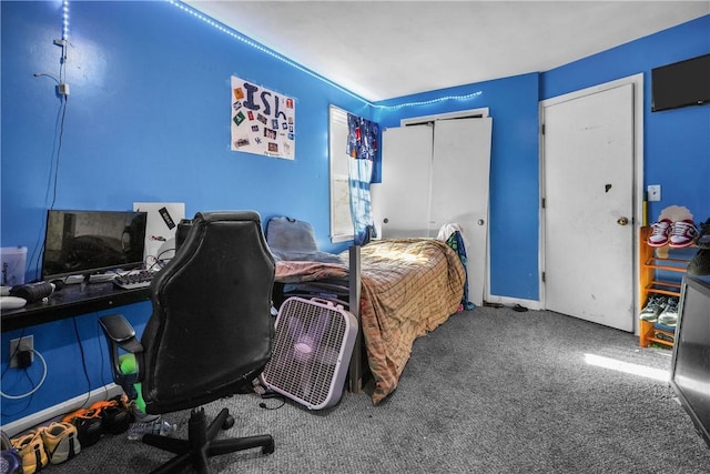 carpeted bedroom featuring a closet