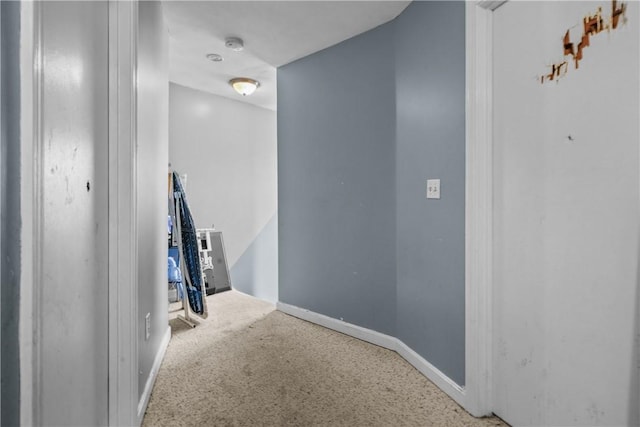 hall featuring baseboards