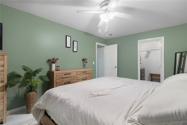 bedroom featuring baseboards and a ceiling fan