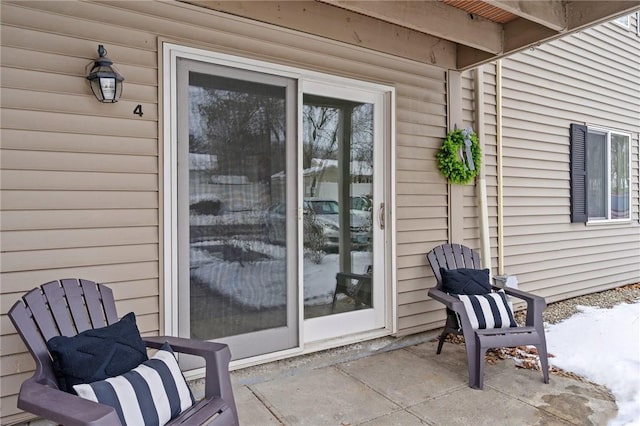 doorway to property with a patio area